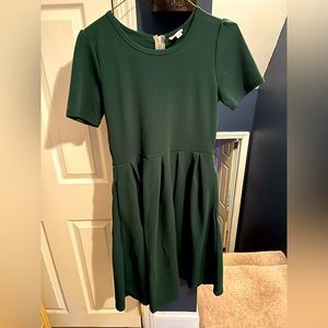 Green Lularoe dress. Zipper back in gold tone. Flare bottom. Asking $20